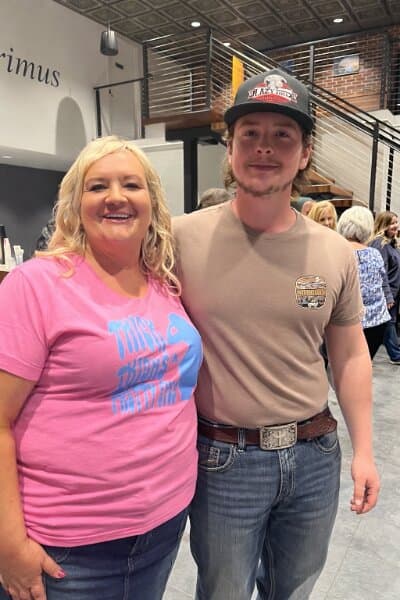 Susan posing with a fan after a show