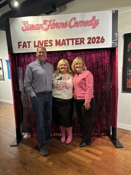 Susan with fans in front of the Susan Horne Comedy banner at Wayne Theatre