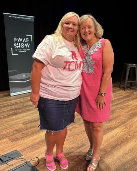Susan with a fan on stage at The Funny Womacks show