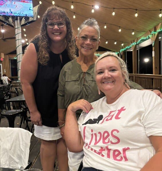Susan hanging out with friends at an outdoor venue