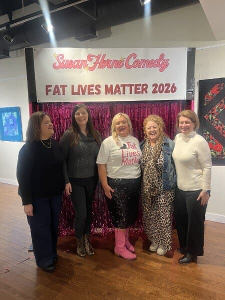 Susan with four fans including one in a leopard print outfit at the photo backdrop
